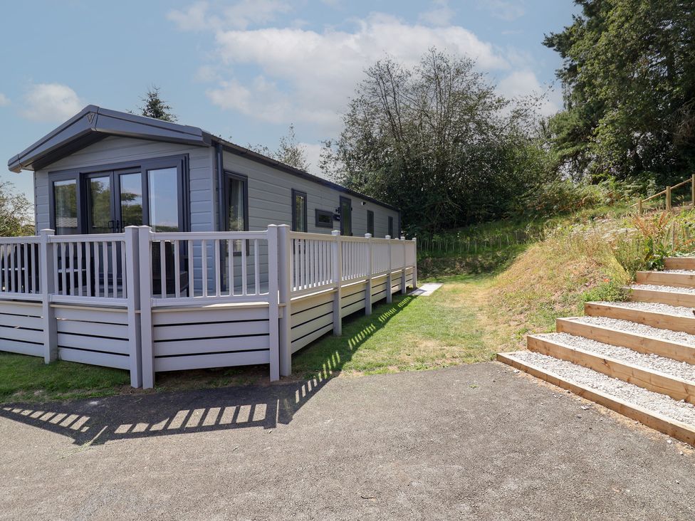A house with a decking area and steps at The Pines 2 Bedrooms Delamere
