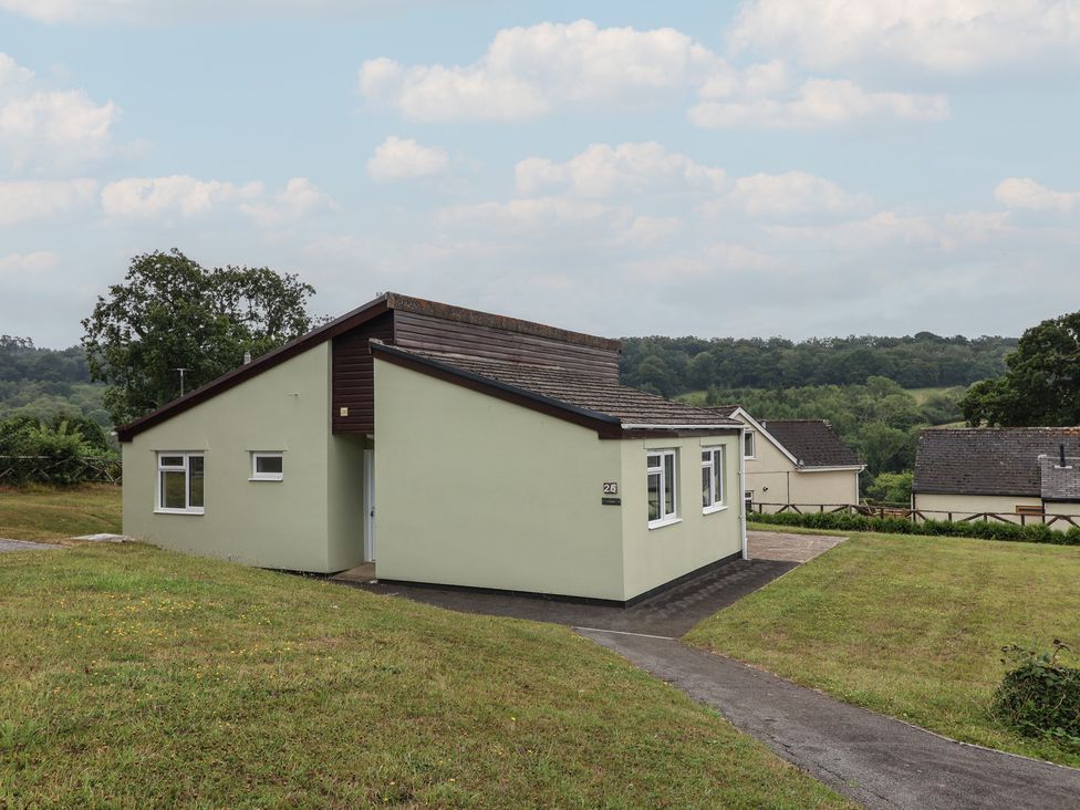 A bungalow with a pathway and grass area at Harcombe House Bungalow 25 Chudleigh