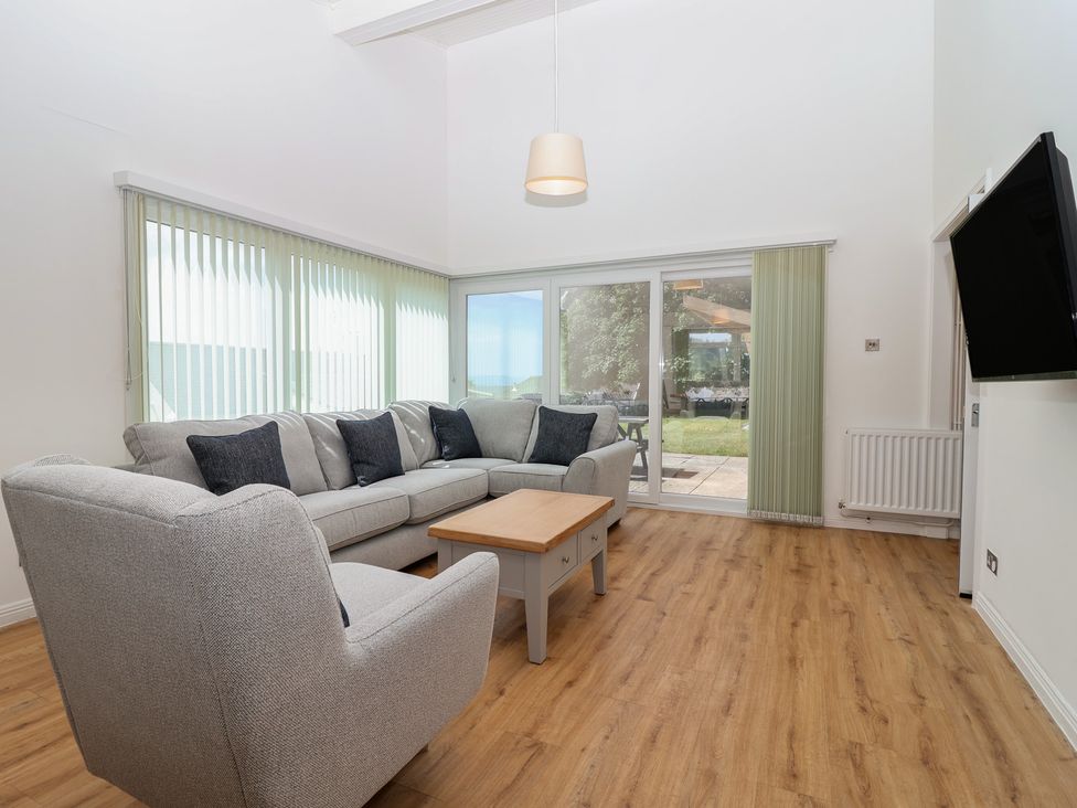 A living room with a sofa and coffee table at Harcombe House Bungalow 25, Chudleigh
