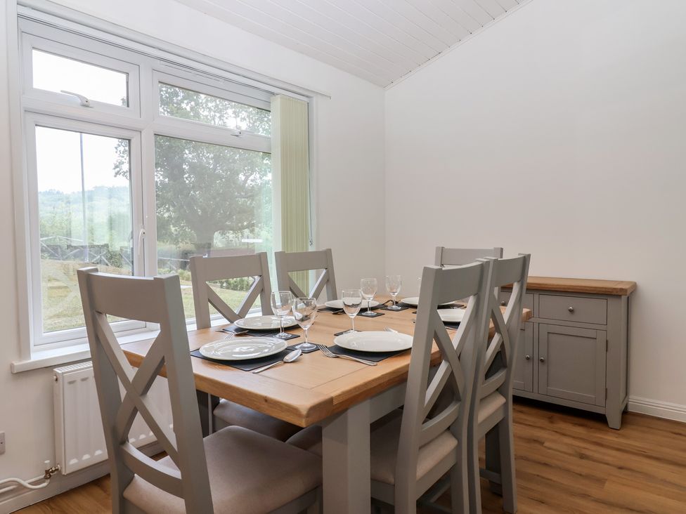 A dining room with a table set for meals at Harcombe House Bungalow 25 Chudleigh