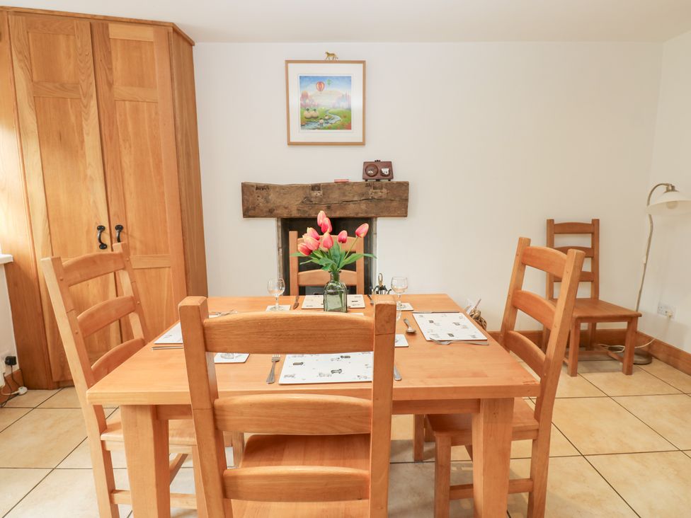 A dining room with a table and chairs at Bridge House