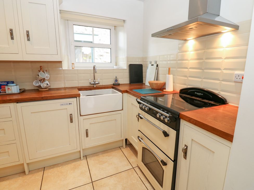 A kitchen with a sink and oven at Bridge House