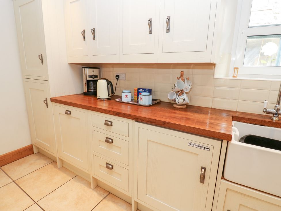 A kitchen with a coffee maker and kettle at Bridge House