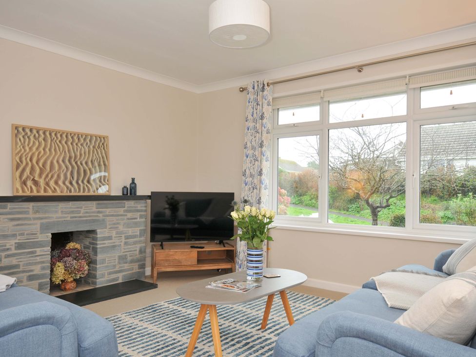 A living room with a television and sofa at 42 Little Trelyn in Rock