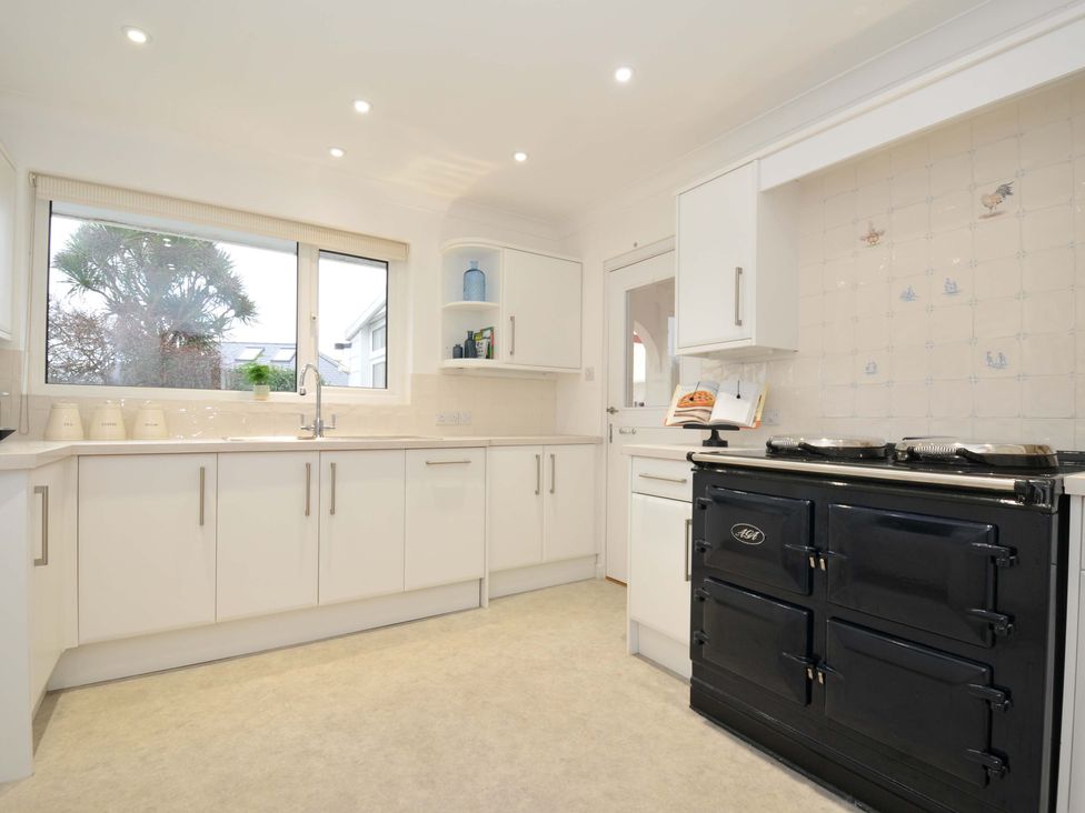 A kitchen with a stove and sink at 42 Little Trelyn in Rock