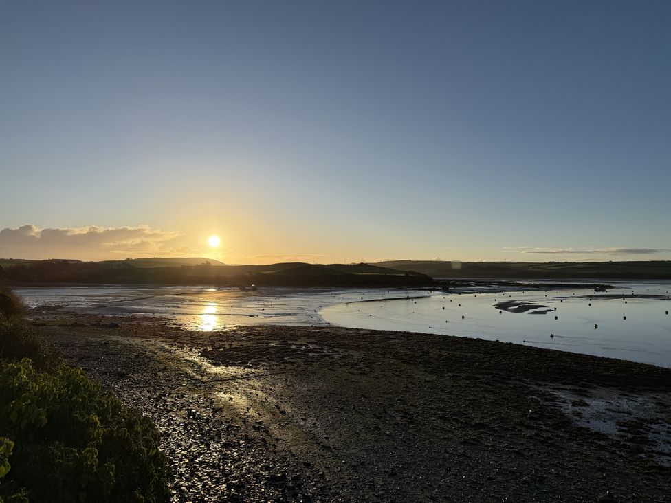 A view of the sunset over a body of water at 42 Little Trelyn Rock
