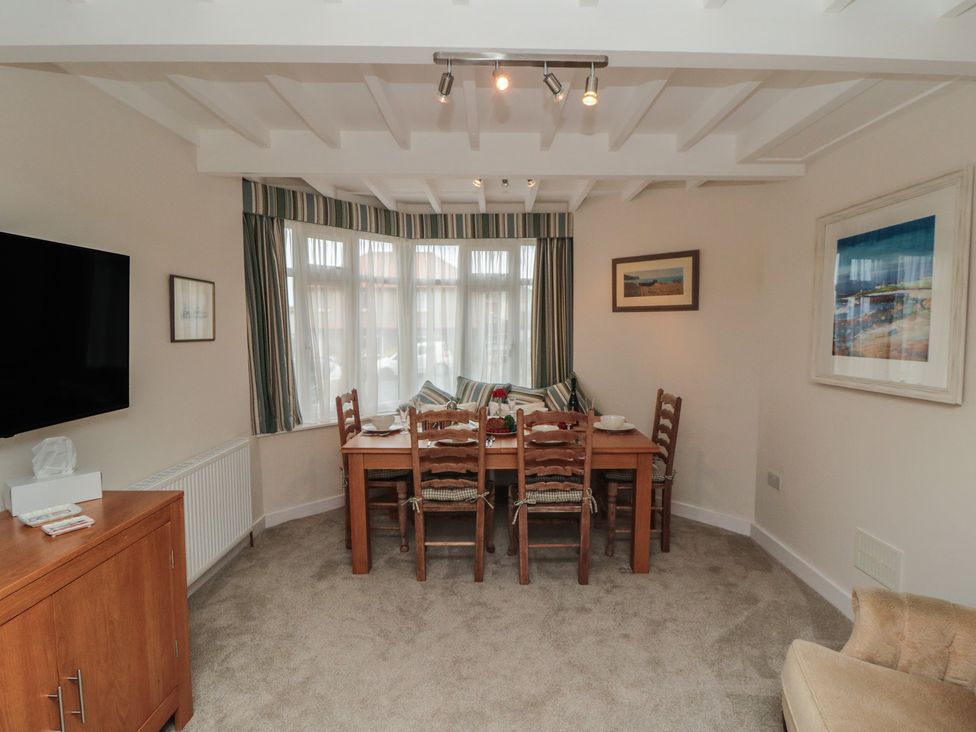 A dining room with a table and chairs at Iveridge in Sandsend