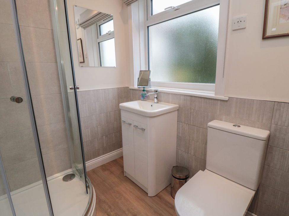A bathroom with a shower, sink, and toilet at Iveridge in Sandsend
