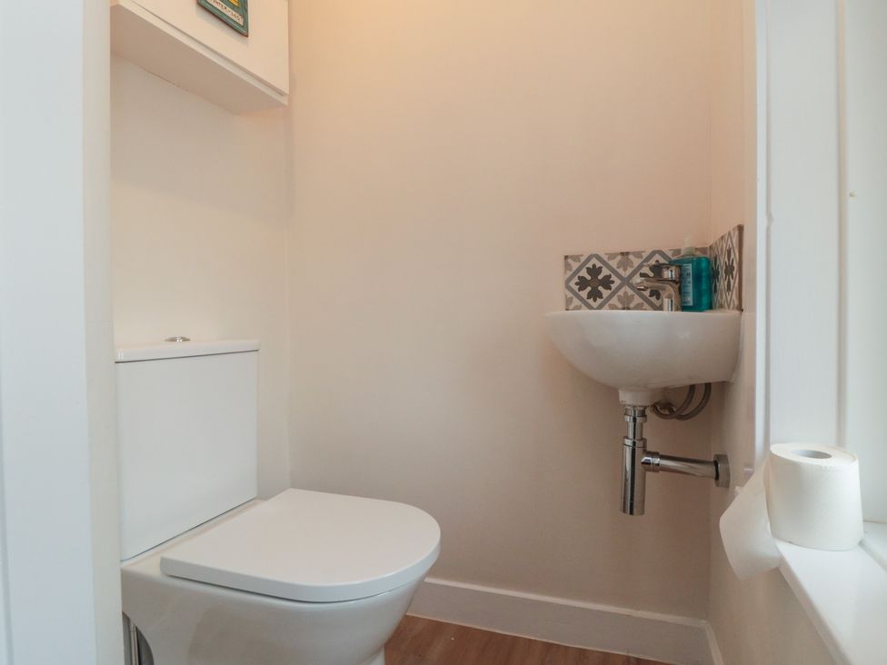 A bathroom with a toilet and a sink at Iveridge in Sandsend