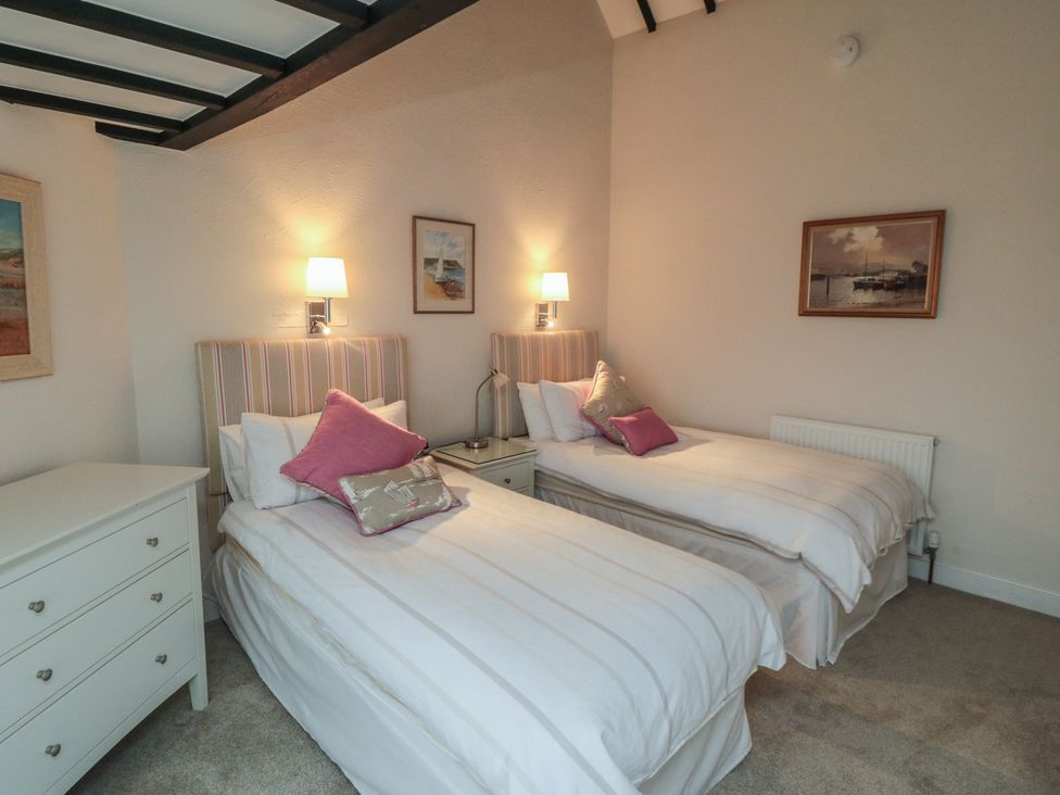 A bedroom with two beds and a chest of drawers at Iveridge in Sandsend