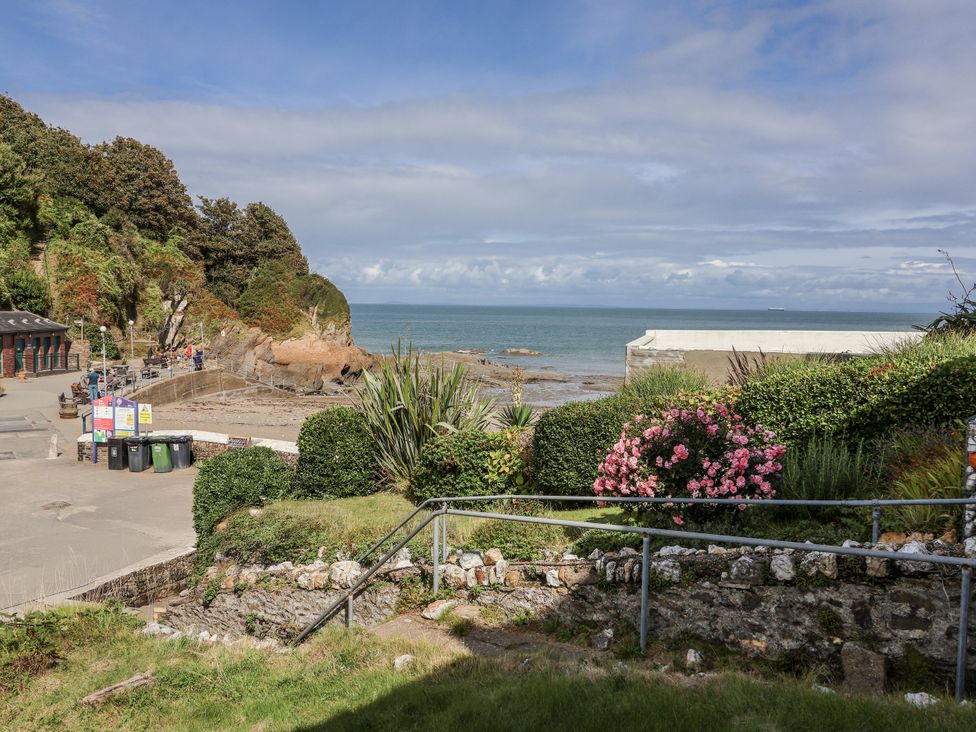 A coastal view with a pathway and plants at Zide the Zea, Hele Bay, Ilfracombe
