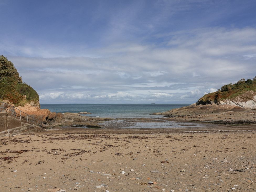 A beach with sand and rocks at Zide the Zea in Hele Bay, Ilfracombe
