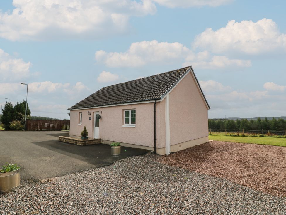 A house with a driveway and garden at The Dairy Airdrie