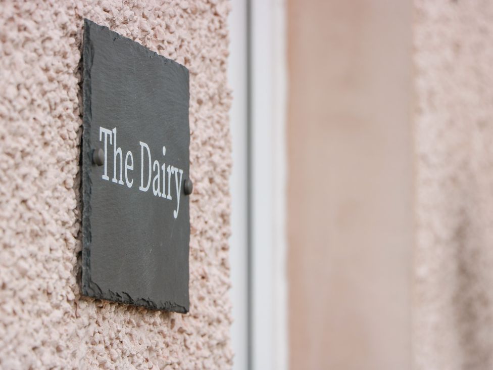 A nameplate reading The Dairy at The Dairy in Airdrie