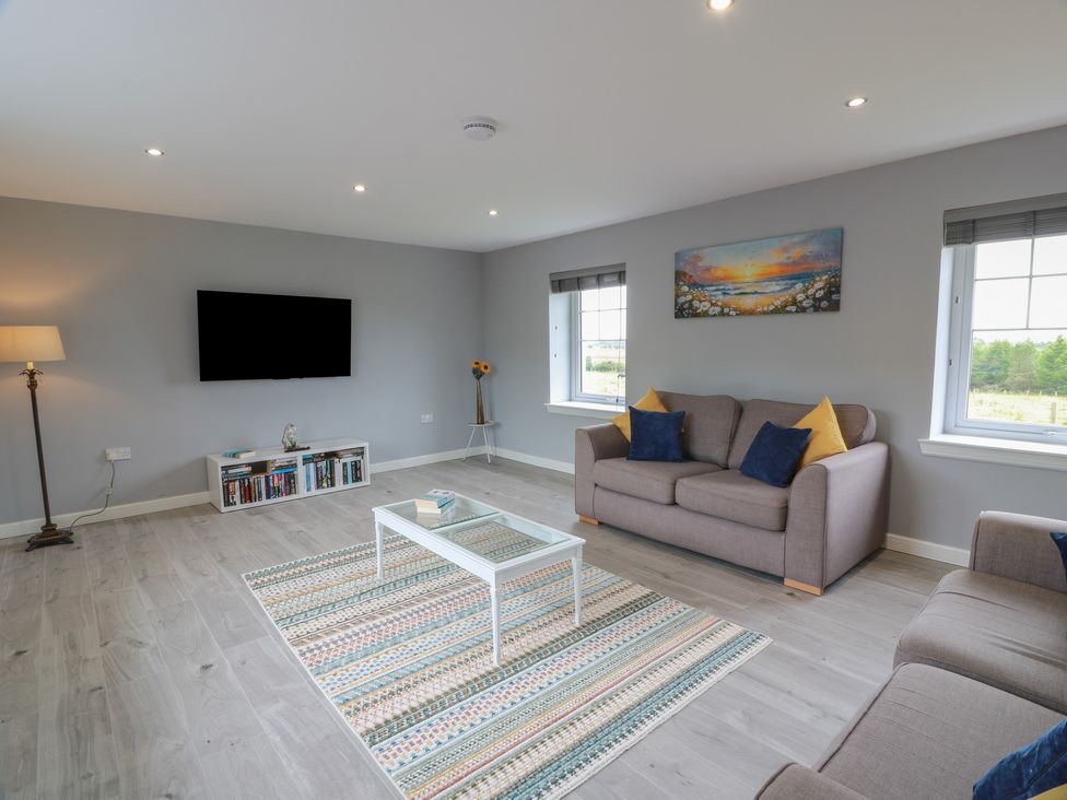 A living room with a sofa and a coffee table at The Dairy in Airdrie
