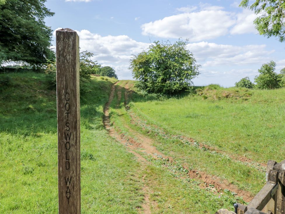 A path marked by a signpost at Stumps Cross Lodge in Upper Coscombe near Winchcombe