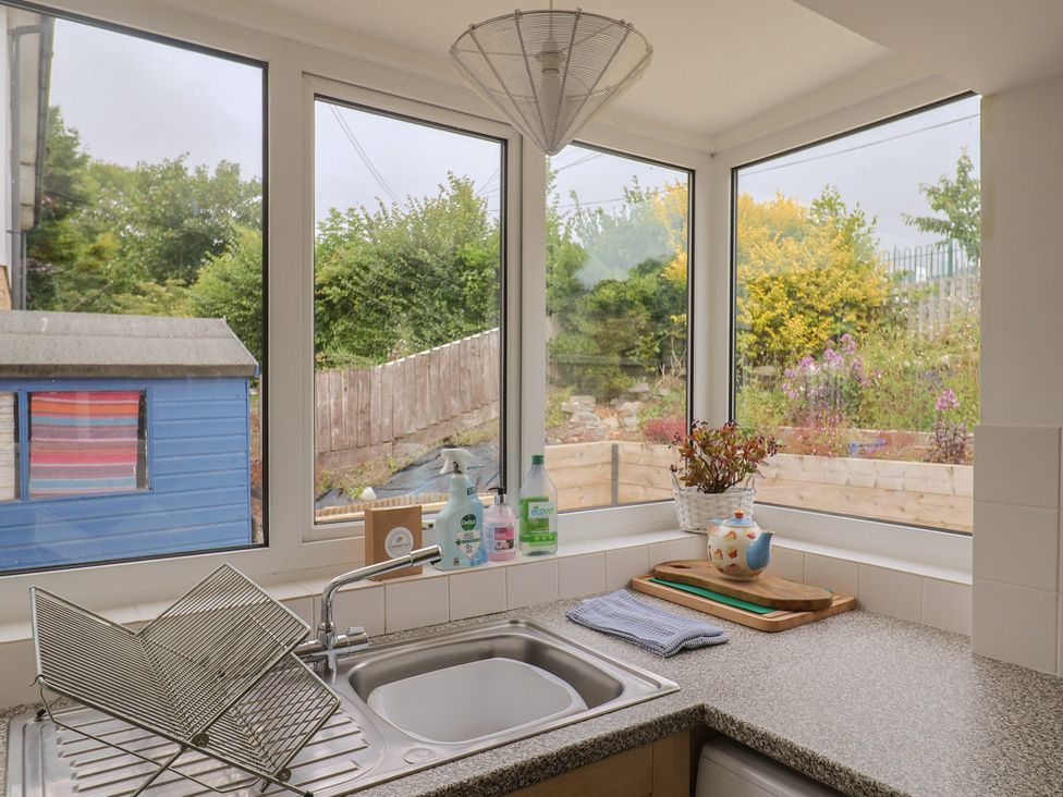 A kitchen with a sink and various items on the counter at 20 Lym Close Lyme Regis