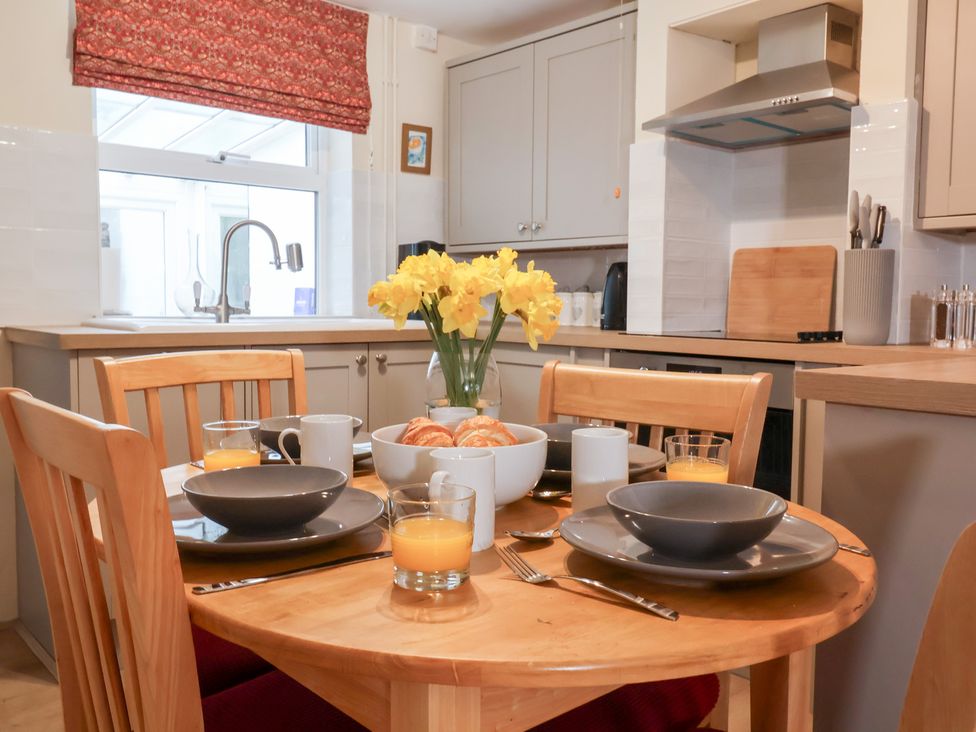 A kitchen with a dining table set for breakfast at Deben Road in Woodbridge