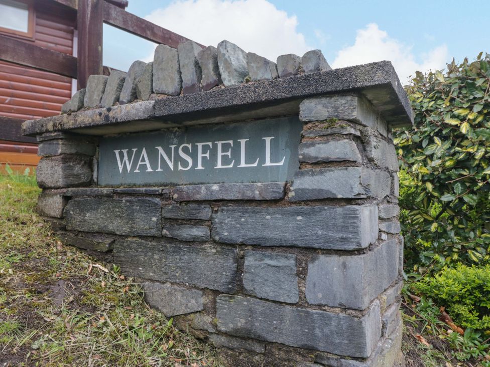 A stone sign with WANSFELL at Wansfell 2 in Limefitt Park near Troutbeck