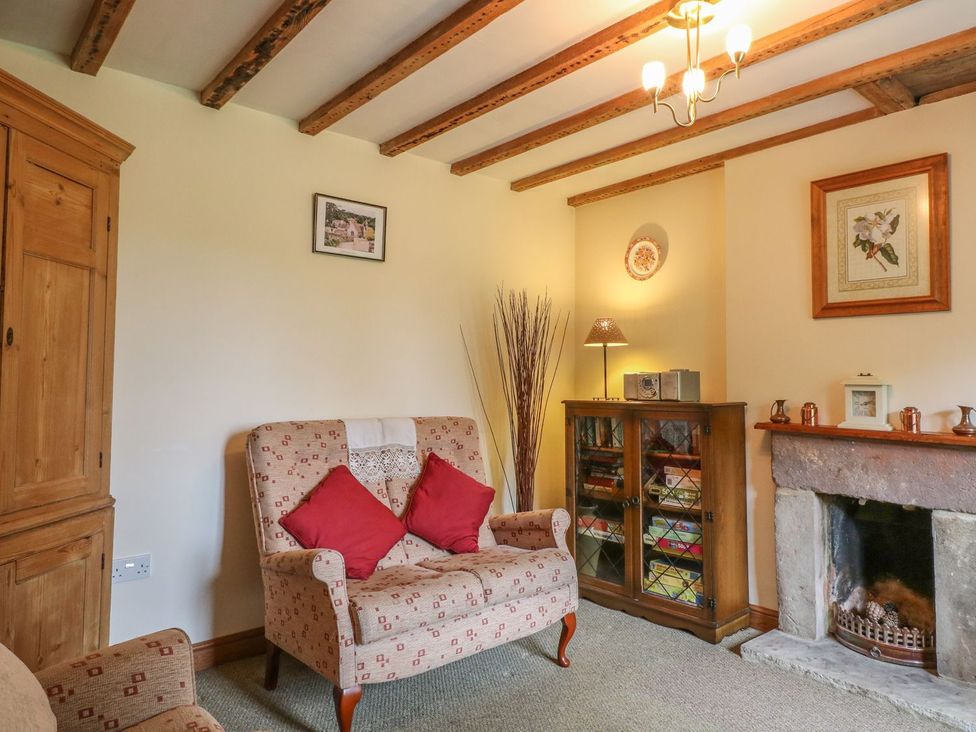 A living room with furniture and a fireplace at Orchard View in Ashbourne