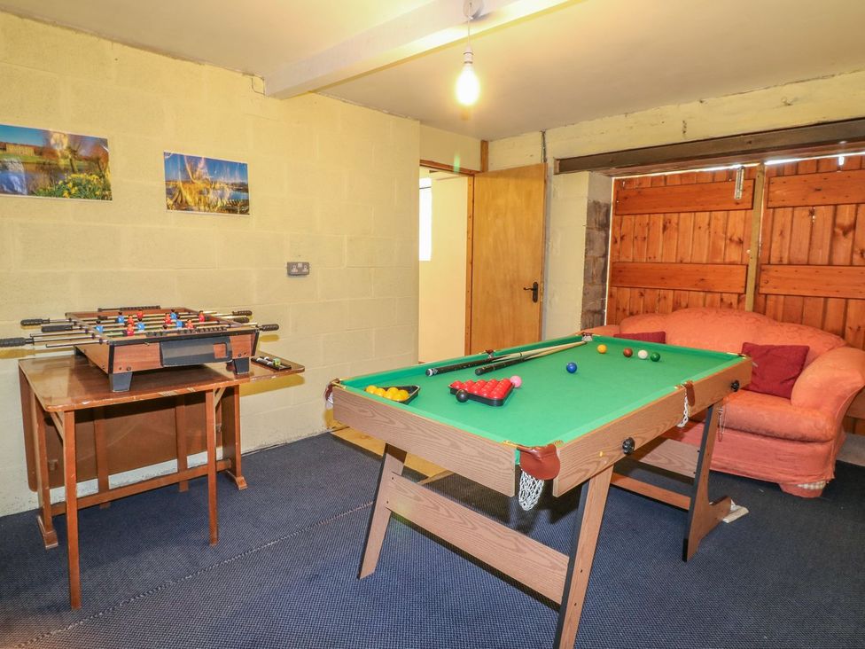 A games room with a foosball table and pool table at Orchard View in Ashbourne