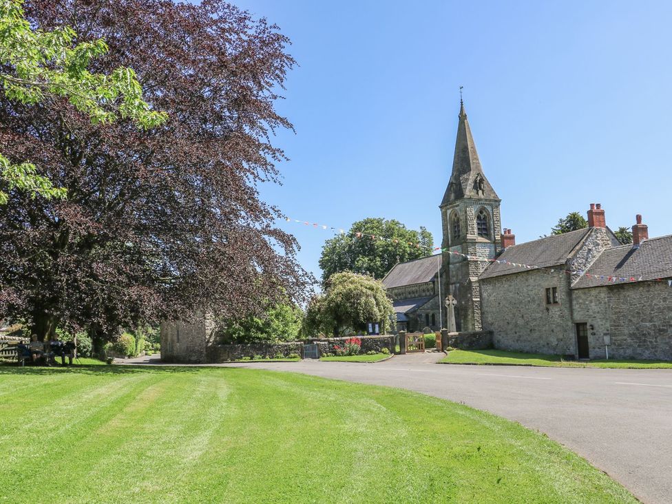 An outdoor view of a church and tree at Orchard View in Ashbourne