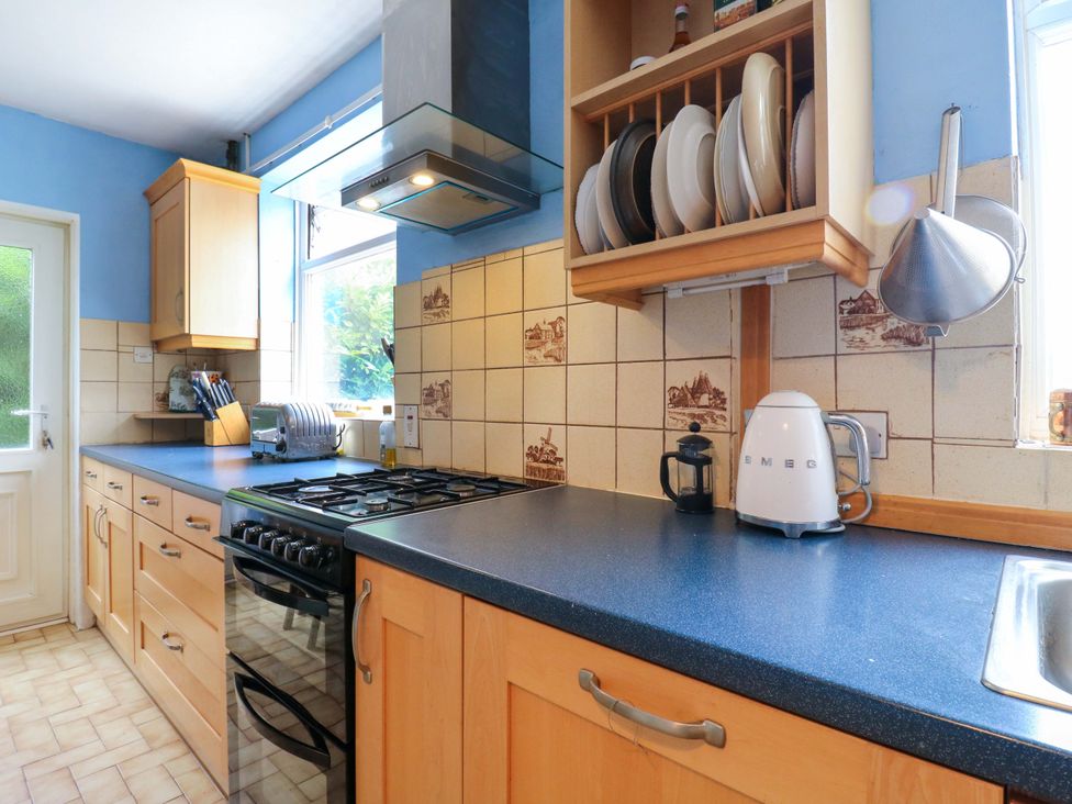 A kitchen with cabinets and appliances at Hillside in High Wycombe