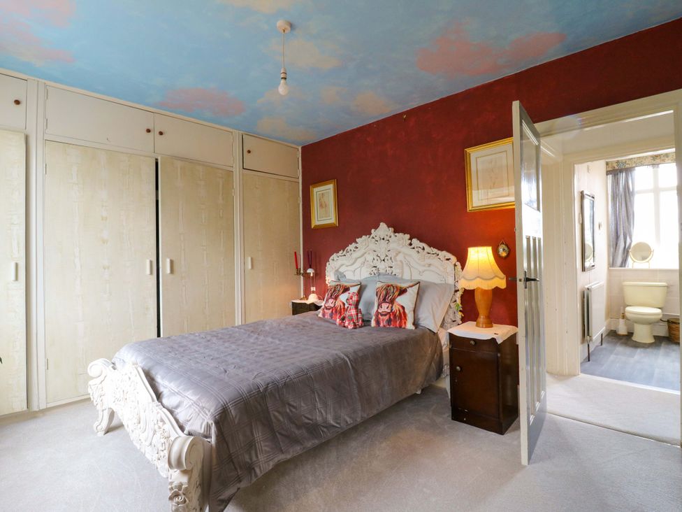 A bedroom with a bed and closet at Hillside in High Wycombe