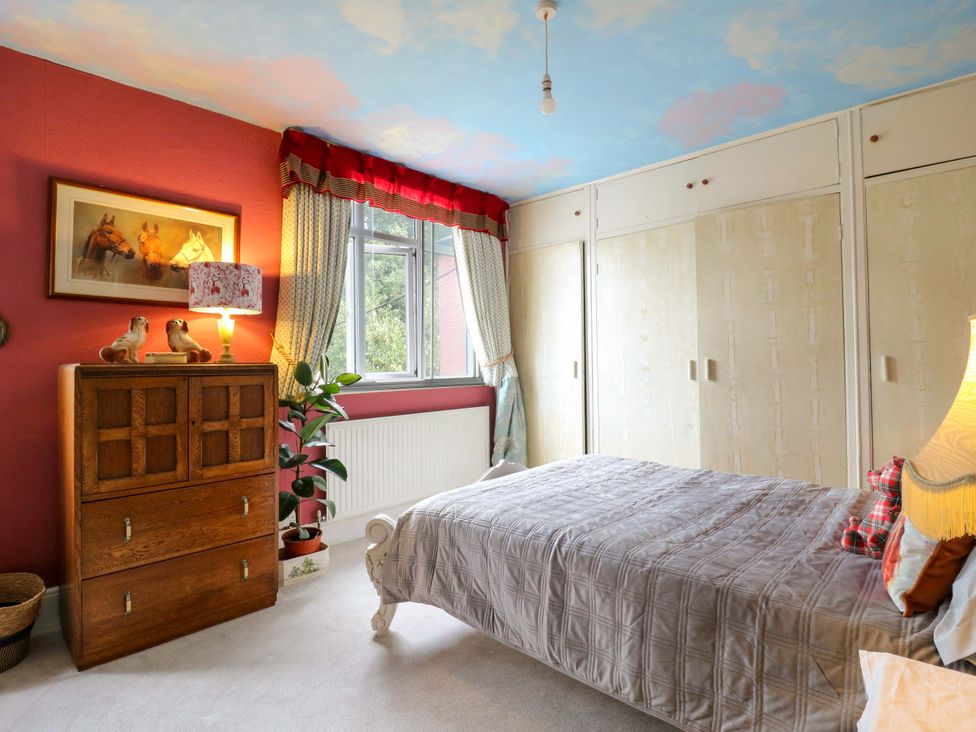 A bedroom with a bed and a chest of drawers at Hillside in High Wycombe