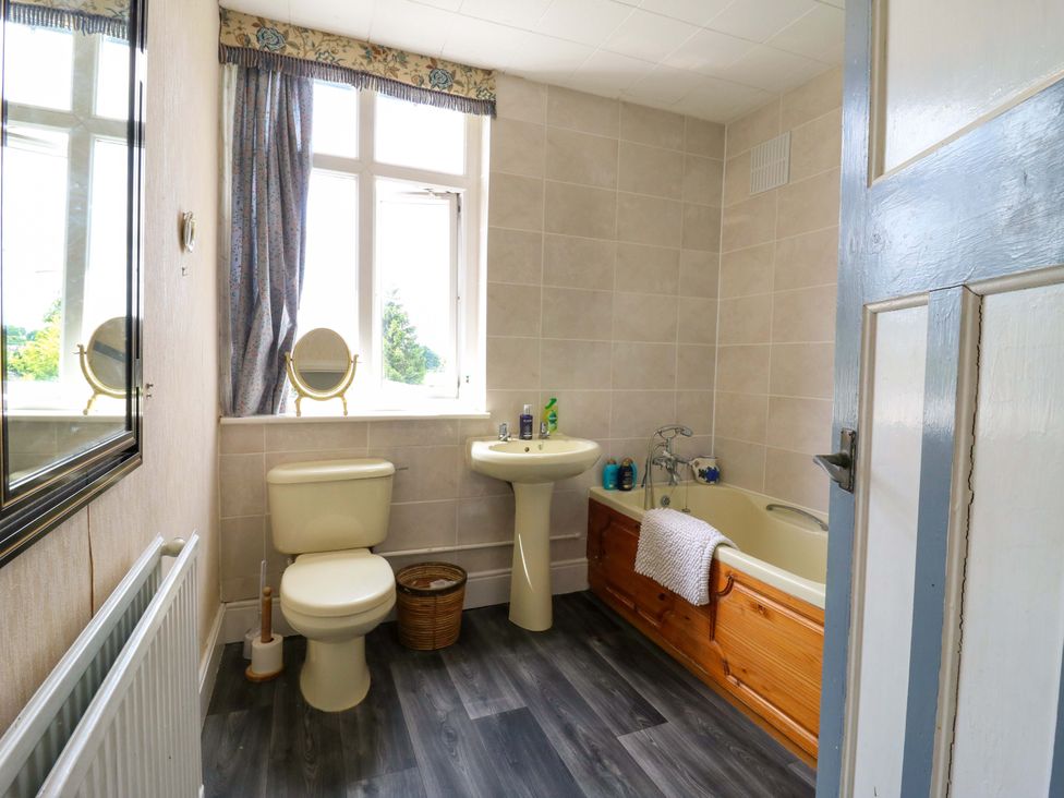 A bathroom with a sink and bathtub at Hillside in High Wycombe