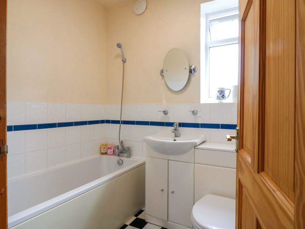 A bathroom with a sink, toilet, bathtub, and a shower at Hillside in High Wycombe
