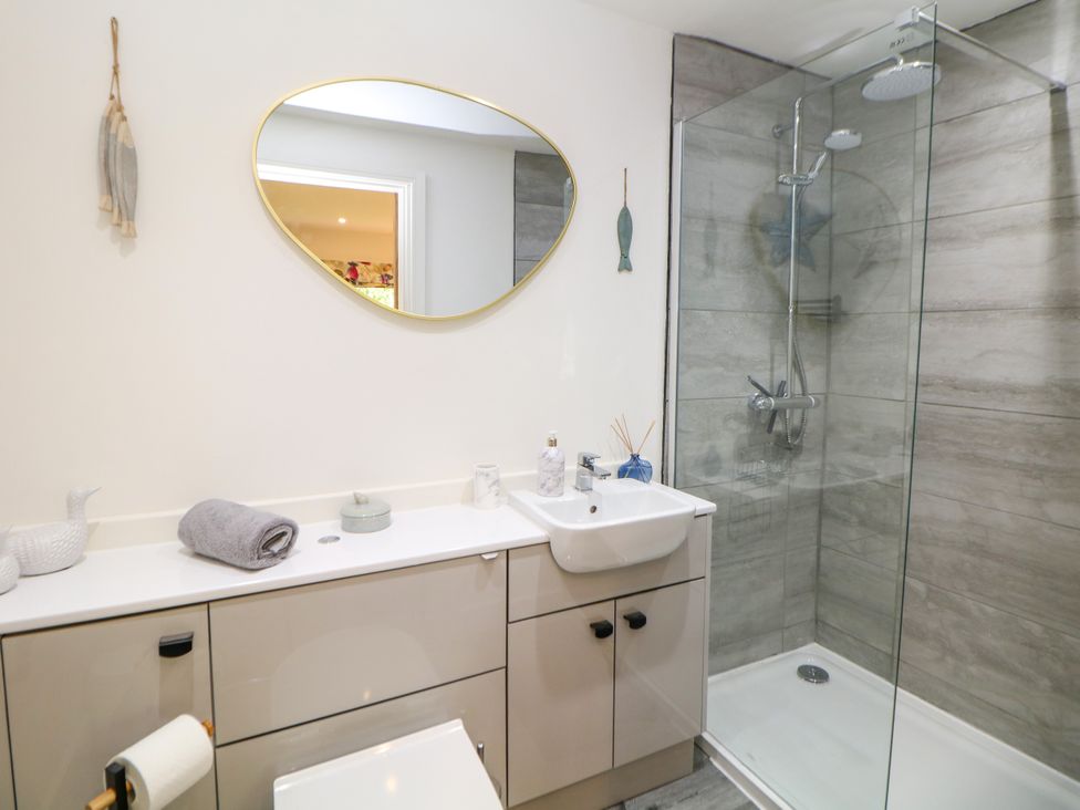 A bathroom with a sink and shower at Stoney Rock Lodge