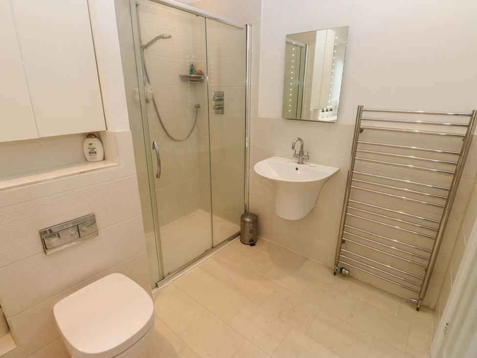 A bathroom with shower, toilet and sink at St Mary's House in Oldham
