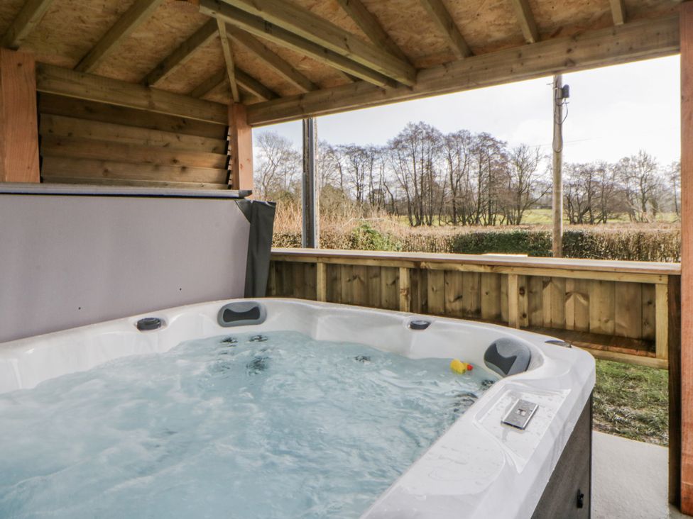 A hot tub in a wooden structure at Glandwr House Crossgates near Llandrindod Wells