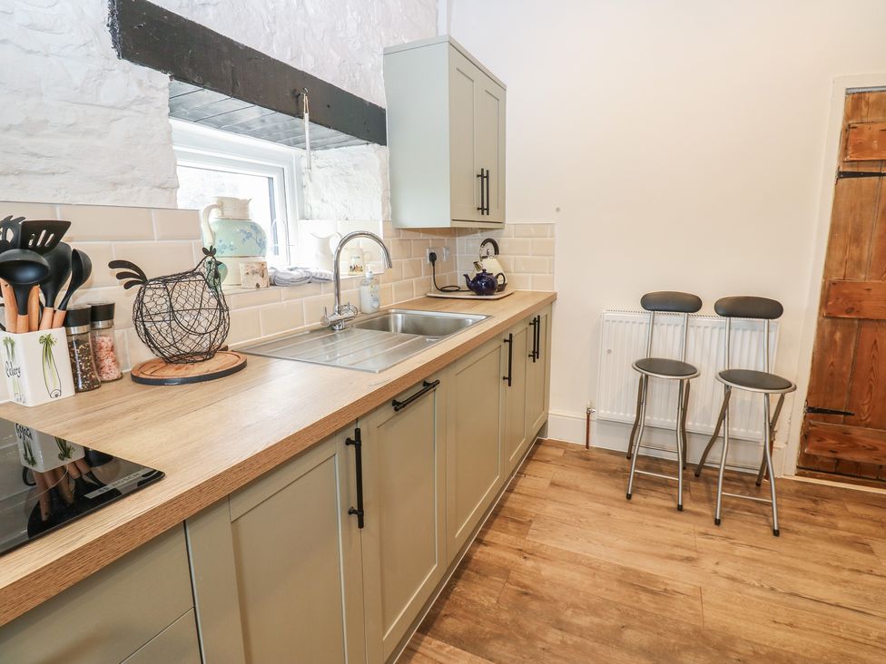 A kitchen with a sink and countertop at Eastend Cottage in West Witton