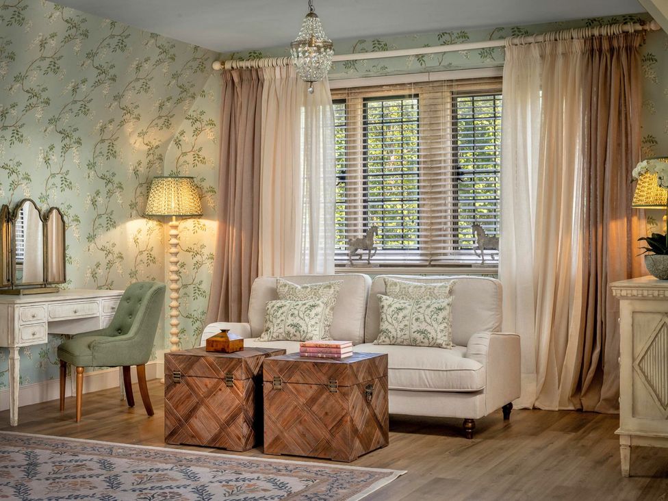 A living room with a sofa and a coffee table at Whistler Rooms