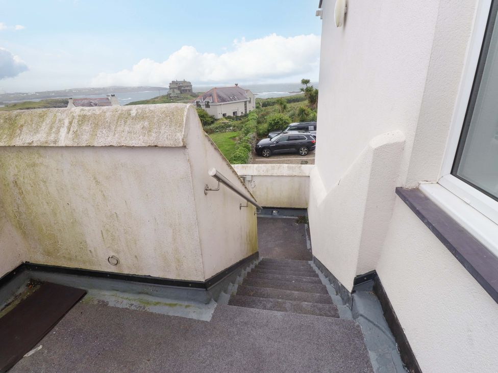 A staircase leading down with a handrail at Sea Views No 8 Plas Darien Trearddur Bay