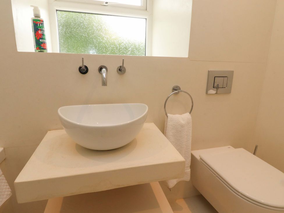 A bathroom with a sink and toilet at Rose Tree Cottage in Skipton