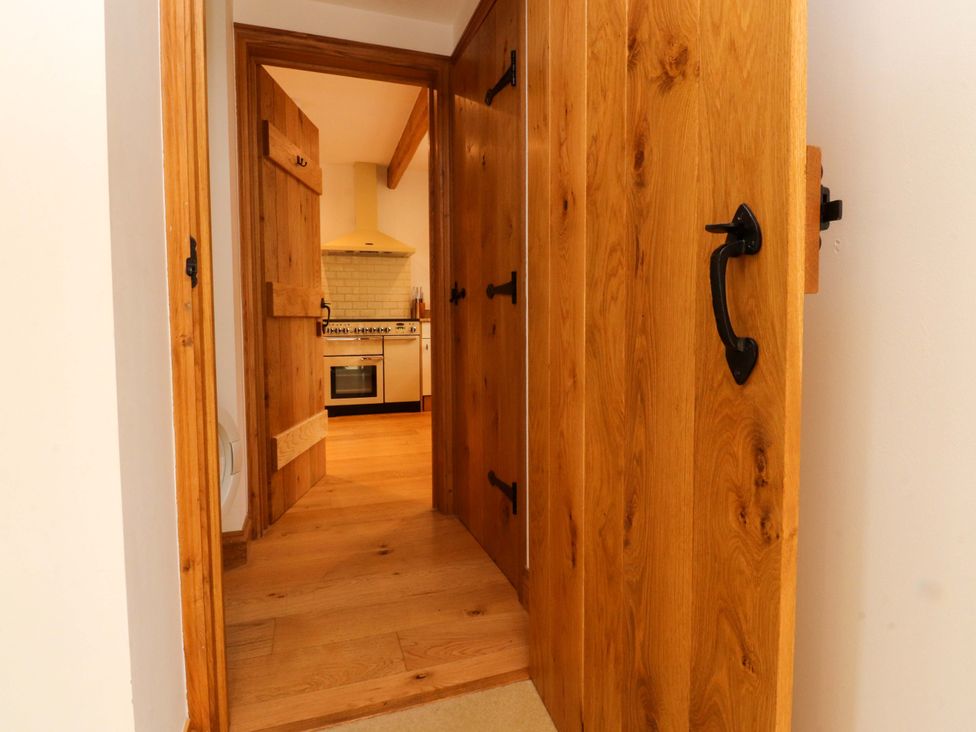 A view of a kitchen through an open door at Rowan Tree Cottage in Skipsea