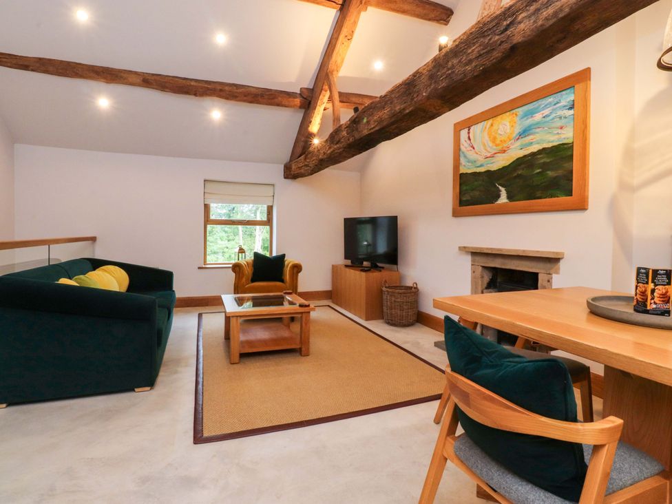 A living room with a television and coffee table at Welly Bob Cottage in Airton