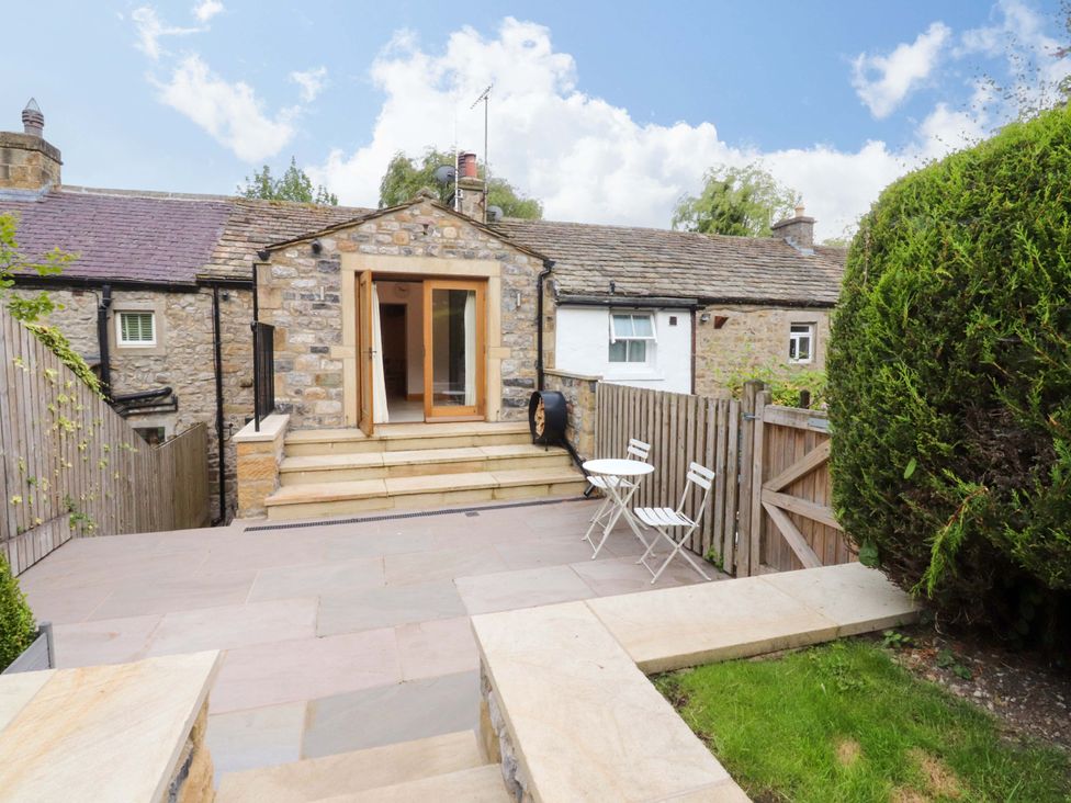 A patio area with a seating set at Welly Bob Cottage in Airton