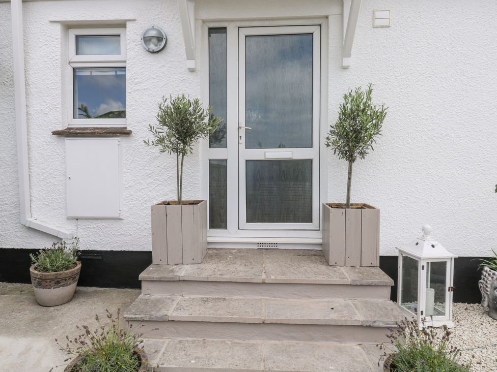 An entrance with steps and planters at 1 Island View Thurlestone