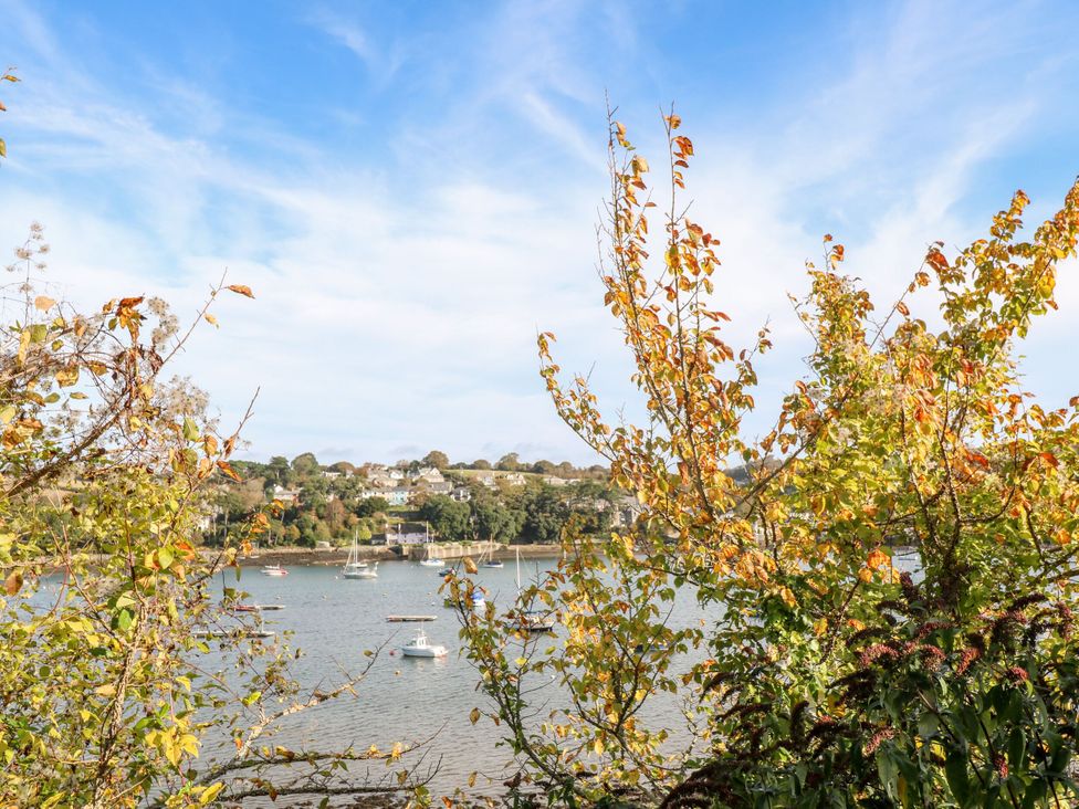 A view of water with boats and trees at The Cow Shed in 