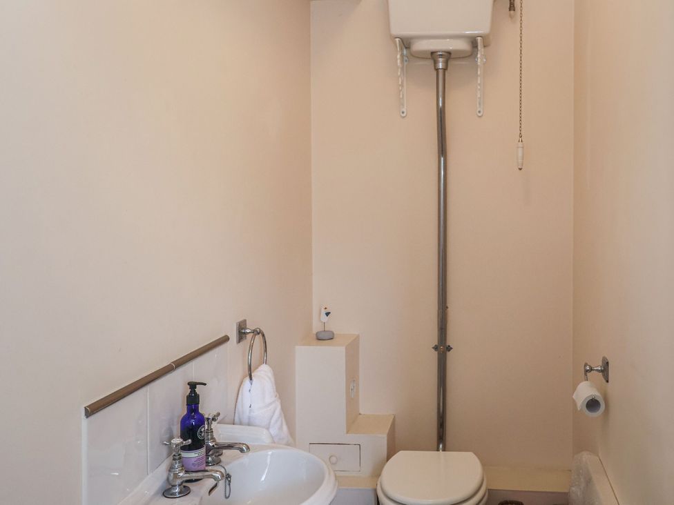 A bathroom with a sink and toilet at 6 The Mews, Felixstowe, Suffolk