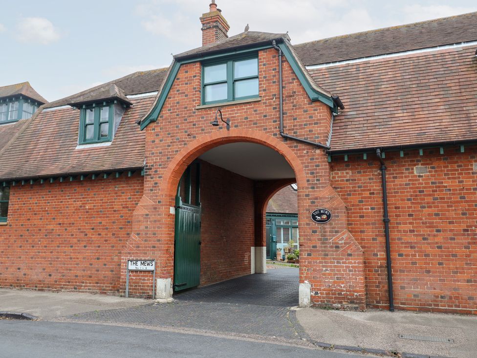 An archway leading to a pathway at The Mews in Felixstowe, Suffolk