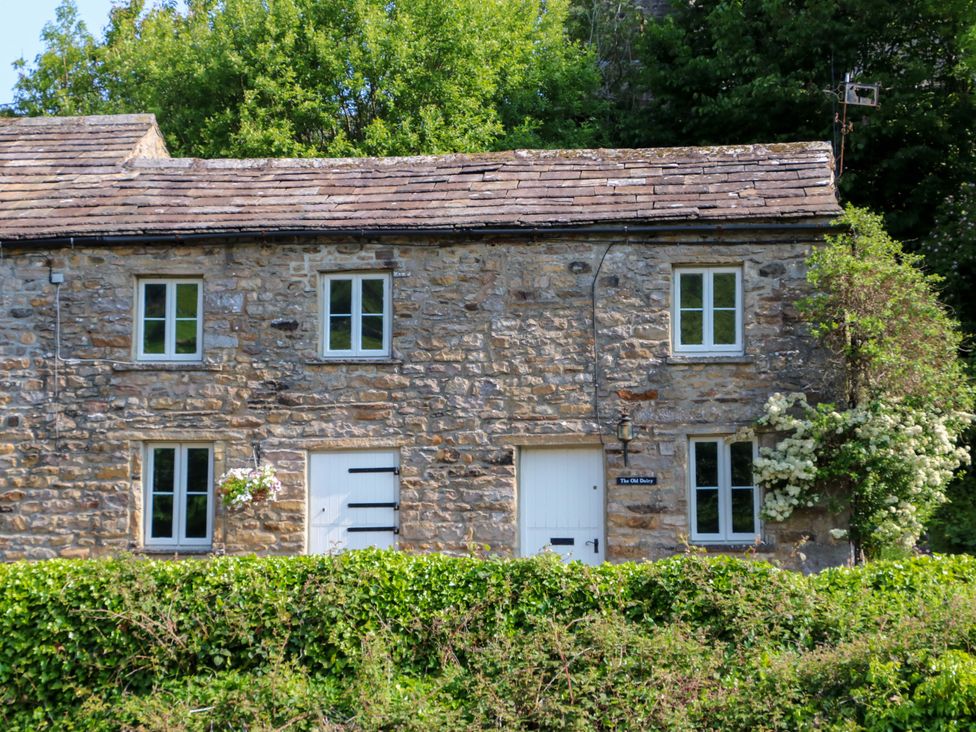 A stone house with windows and door at The Old Dairy in Richmond