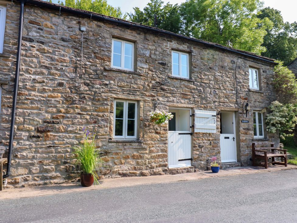 An outdoor view of a stone building with windows and doors at The Old Dairy in Richmond