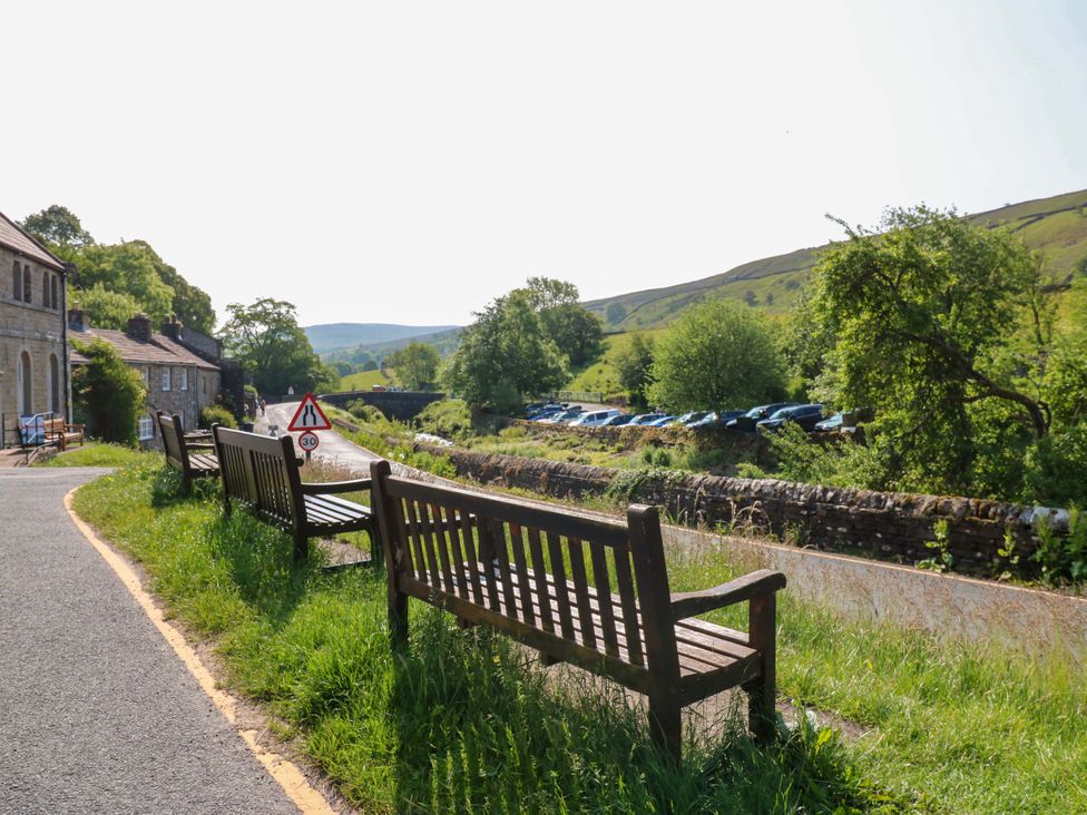 An outdoor scene with benches along a road at The Old Dairy in Richmond