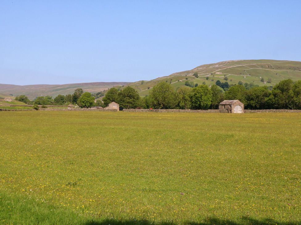 A field with buildings and trees at The Old Dairy in Richmond
