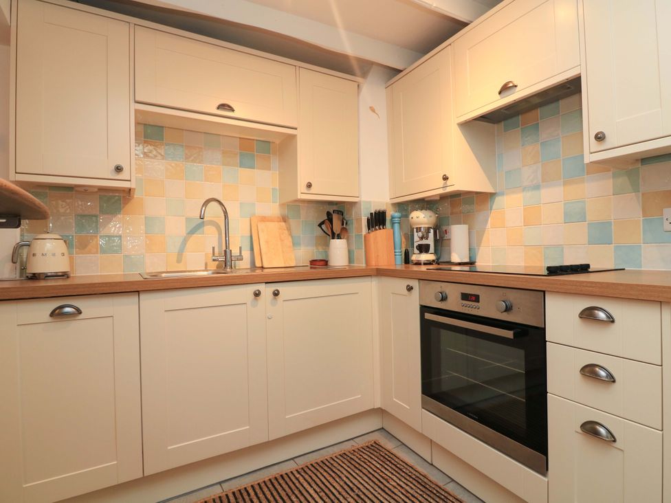 A kitchen with sink and oven at 2 The Square, Hope Cove